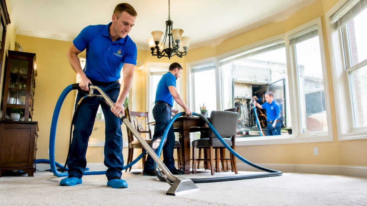 Master Service Pro crew using truck-mounted carpet cleaning system